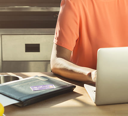 woman on laptop using credit card